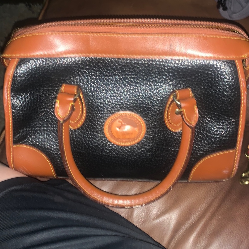 Medium size Brown and black dooney and bourke purse.  Very clean 3 inside pocket
